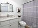 Charming bathroom with granite countertop, stylish fixtures, and a decorative shower curtain at 182 Mackenzie Ct, China Grove, NC 28023