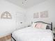 This bedroom features white walls, plush bedding, and stylish decor for a cozy, inviting space at 182 Mackenzie Ct, China Grove, NC 28023
