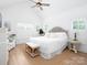 Spacious Primary bedroom with vaulted ceilings, large windows, and a luxurious king-size bed at 182 Mackenzie Ct, China Grove, NC 28023