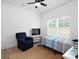 Cozy bedroom with a comfortable chair, TV, and a large window that provides plenty of natural light at 182 Mackenzie Ct, China Grove, NC 28023