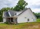Charming two-story home with stone accents, manicured lawn, and inviting front porch at 182 Mackenzie Ct, China Grove, NC 28023