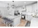 Bright and modern kitchen featuring granite countertops, stainless steel appliances, and a large central island at 182 Mackenzie Ct, China Grove, NC 28023