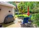 Outdoor living with a patio, lush lawn, palm tree and grill, perfect for entertaining at 19539 Denae Lynn Dr, Cornelius, NC 28031