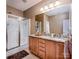 Bathroom showcasing a glass-enclosed shower and granite countertops for a luxurious feel at 19539 Denae Lynn Dr, Cornelius, NC 28031