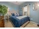 Well-lit bedroom with a cozy bed, curtains, and ample natural light from the window at 19539 Denae Lynn Dr, Cornelius, NC 28031