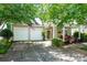 Charming home boasting a two-car garage and inviting covered front porch with cozy seating at 19539 Denae Lynn Dr, Cornelius, NC 28031