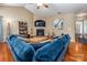 Bright living room with a vaulted ceiling, fireplace, and comfortable blue sectional sofa at 19539 Denae Lynn Dr, Cornelius, NC 28031