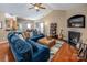 Spacious living room featuring a fireplace, vaulted ceiling, and comfortable seating at 19539 Denae Lynn Dr, Cornelius, NC 28031