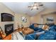 Inviting living room with fireplace, guitars, TV, and a large sectional sofa at 19539 Denae Lynn Dr, Cornelius, NC 28031
