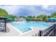 Spacious community pool offers plenty of room for swimming and relaxing with a pool house in the background at 19539 Denae Lynn Dr, Cornelius, NC 28031