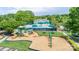 A gorgeous aerial view of the pool and playground area of this community, complete with shady areas and chairs at 19539 Denae Lynn Dr, Cornelius, NC 28031
