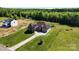 Stunning aerial view of a beautiful home with lush landscaping and a long driveway at 1974 Glen Manor Ct, Lincolnton, NC 28092