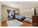 Bedroom with hardwood floors, large window and a gaming setup at 1974 Glen Manor Ct, Lincolnton, NC 28092