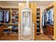 Spacious walk-in closet with custom shelving and hardwood floors at 1974 Glen Manor Ct, Lincolnton, NC 28092