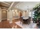 Dining room featuring hardwood floors, a chandelier, and an arched doorway leading to the foyer at 1974 Glen Manor Ct, Lincolnton, NC 28092