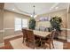 Elegant dining room boasts hardwood floors, a tray ceiling, and large windows for natural light at 1974 Glen Manor Ct, Lincolnton, NC 28092