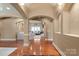 Bright foyer featuring arched doorways, hardwood floors, and a view into the living room with ample seating at 1974 Glen Manor Ct, Lincolnton, NC 28092