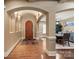 Elegant foyer with hardwood floors, arched doorways, recessed lighting, and views into the dining room at 1974 Glen Manor Ct, Lincolnton, NC 28092