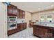 Bright kitchen featuring stainless steel appliances, granite countertops, and adjacent dining area at 1974 Glen Manor Ct, Lincolnton, NC 28092