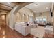 Spacious living room with hardwood floors, archways, recessed lighting, and comfortable seating arrangements at 1974 Glen Manor Ct, Lincolnton, NC 28092