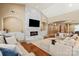 Inviting living room features a fireplace, archways, built-in cabinets, and comfortable seating at 1974 Glen Manor Ct, Lincolnton, NC 28092