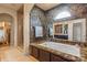 Elegant main bathroom with stone accents, a soaking tub, and a separate shower at 1974 Glen Manor Ct, Lincolnton, NC 28092