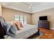 Relaxing main bedroom with a large window, hardwood floors, and traditional furnishings at 1974 Glen Manor Ct, Lincolnton, NC 28092