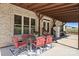 Charming outdoor patio with brick exterior, covered space, and dining set perfect for entertaining at 1974 Glen Manor Ct, Lincolnton, NC 28092