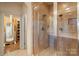 Glass door shower with tile surround and doorless entry at 1974 Glen Manor Ct, Lincolnton, NC 28092