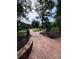 Park setting with brick path and view of surrounding cityscape at 210 N Church St, Charlotte, NC 28202