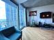 Bright living room with floor to ceiling windows and city views at 210 N Church St, Charlotte, NC 28202