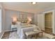 Inviting bedroom with light-blue walls, a plush bed, and an open doorway leading to another room at 2126 Robby Dr, Maiden, NC 28650