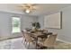 Dining room featuring a wooden table with seating for six, complemented by an elegant ceiling fan at 2126 Robby Dr, Maiden, NC 28650
