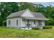 Cute one-story home featuring a welcoming front porch and established landscaping at 2126 Robby Dr, Maiden, NC 28650