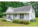 Charming single-story home featuring a covered front porch and mature trees at 2126 Robby Dr, Maiden, NC 28650