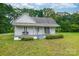 Charming single-story house with a cozy front porch and lush green lawn at 2126 Robby Dr, Maiden, NC 28650