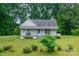 Charming single-story home with a covered front porch surrounded by lush landscaping at 2126 Robby Dr, Maiden, NC 28650