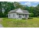 Charming home featuring a covered front porch, and lush greenery at 2126 Robby Dr, Maiden, NC 28650