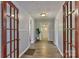 Inviting hallway with wood-look floors, paneled walls, and decorative doors leading to various rooms at 2126 Robby Dr, Maiden, NC 28650