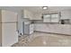 Bright kitchen featuring white cabinets, retro appliances, and natural light from the window at 2126 Robby Dr, Maiden, NC 28650