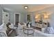 Bright living room features comfortable seating, modern decor, wood-look flooring, and an open layout at 2126 Robby Dr, Maiden, NC 28650