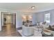 Bright living room with stylish furniture, wood-look flooring, and an open doorway leading to the hallway at 2126 Robby Dr, Maiden, NC 28650