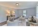 Elegant living room with plush seating, stylish decor, a neutral color palette, and gleaming wood-look floors at 2126 Robby Dr, Maiden, NC 28650