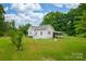 Aerial view of the rear exterior of a single-story house with a covered parking area on a large lot at 2126 Robby Dr, Maiden, NC 28650