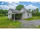 Rear view of home featuring covered parking, gravel driveway, and convenient access to the backyard at 2126 Robby Dr, Maiden, NC 28650