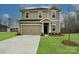 Two-story home featuring a two car garage, a well-kept lawn, and neutral siding at 2139 Rolling Hills Ct, Stanley, NC 28164