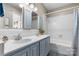Bathroom featuring a double vanity and tiled shower and tub at 220 Pinehurst Ln, Newton, NC 28658