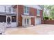 Exterior view of brick home featuring a walk out porch, garage and shed at 220 Pinehurst Ln, Newton, NC 28658