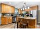 Kitchen features stainless steel appliances, island with bar seating and wood cabinets at 220 Pinehurst Ln, Newton, NC 28658
