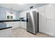 Bright kitchen boasts stainless steel appliances, sleek black countertops, and ample white cabinetry at 220 Pinehurst Ln, Newton, NC 28658